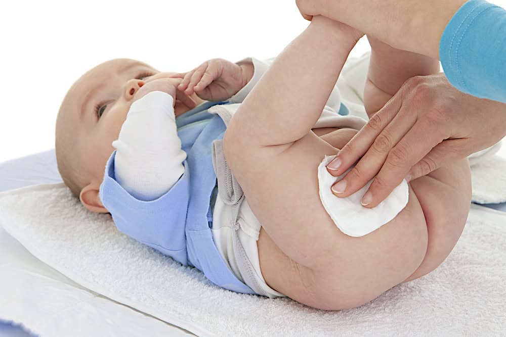 baby having bottom wiped