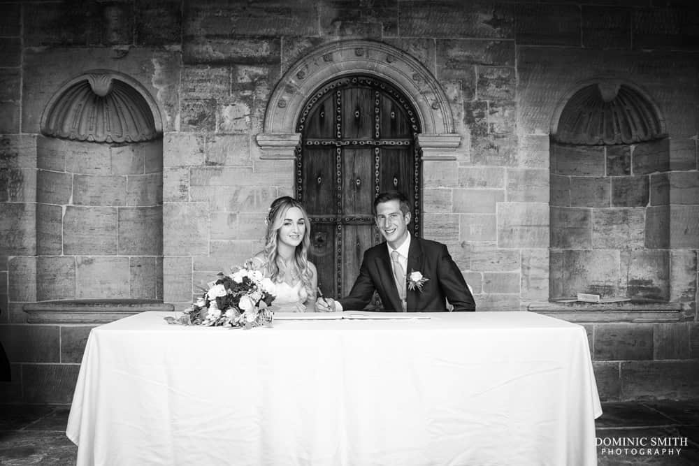 Signing the register at Nymans