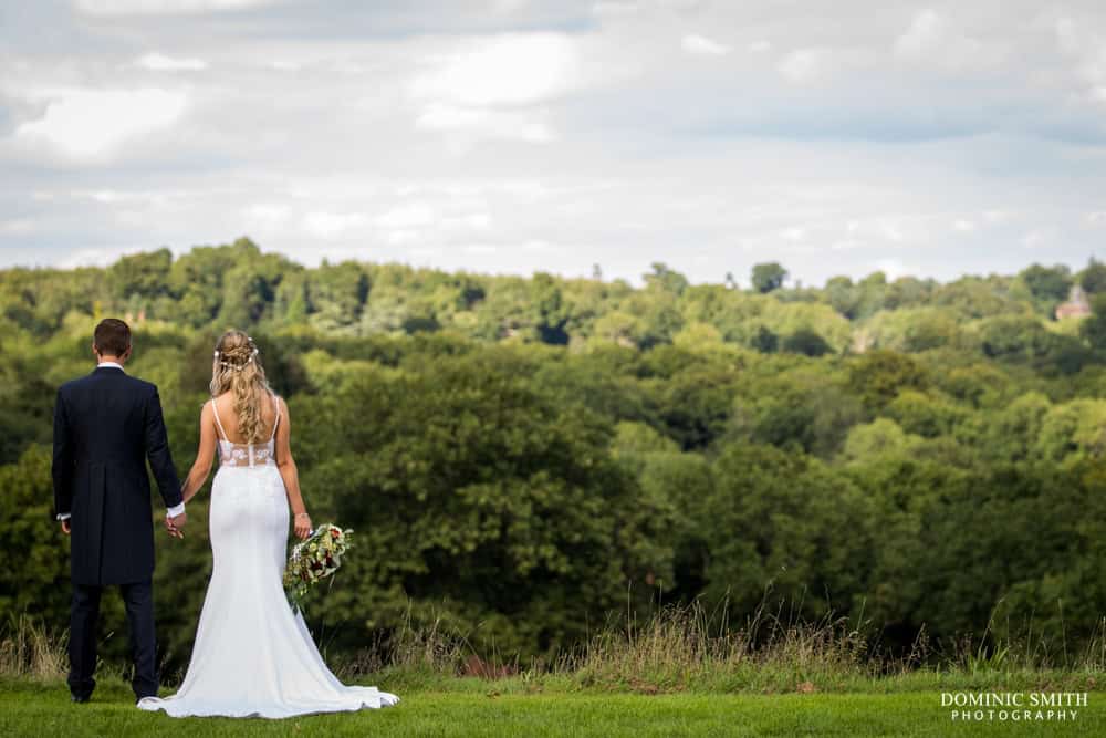 Couple photo looking out towards the hills at Nymans