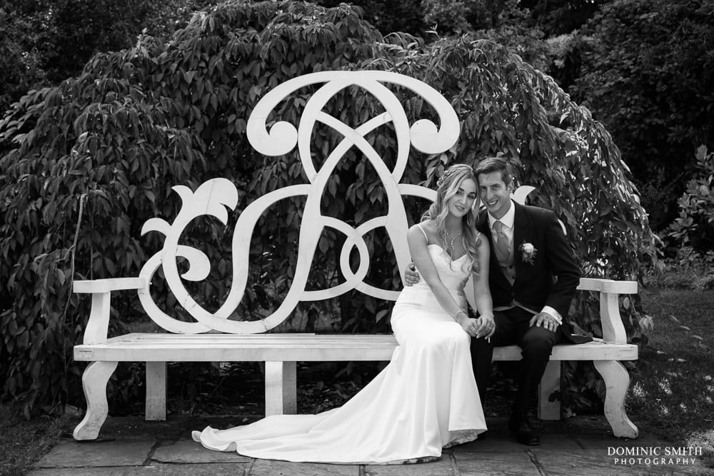 Wedding photo taken on the bench at Nymans