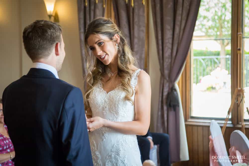 Exchanging wedding rings at Nutfield Priory