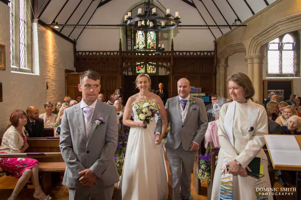 Bride walking down the aisle at St Augustines Church