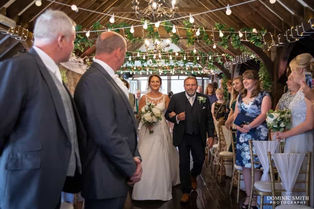 Bride coming down the aisle at Blackstock Country Estate