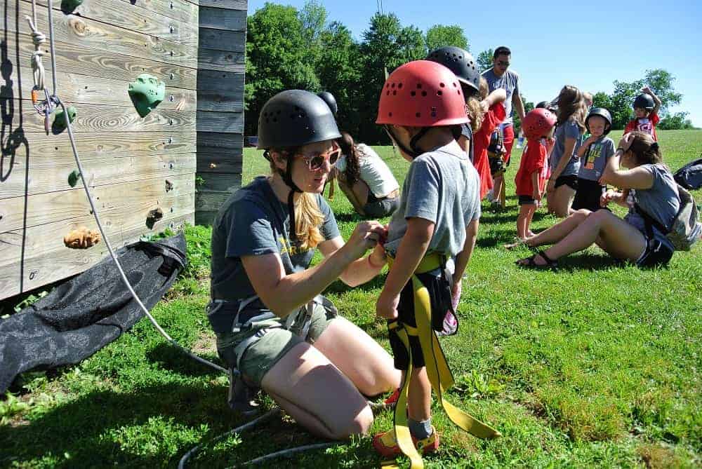staff2 Little boy getting ready for rock climbing