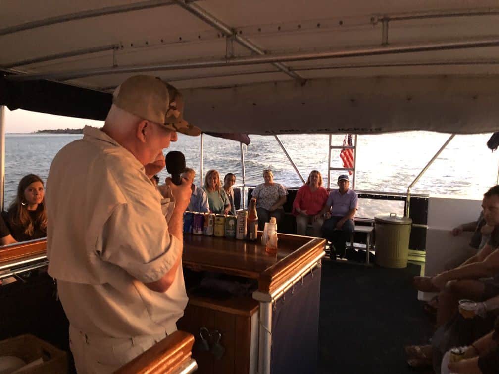 Speaker speaking to the group. Party boat rental Charleston, SC