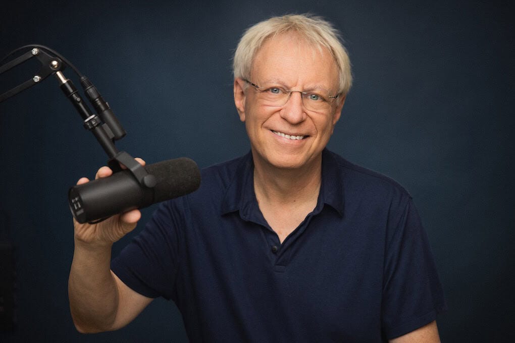 Popular music industry podcast host with microphone in recording studio for music industry insights and digital marketing strategies.