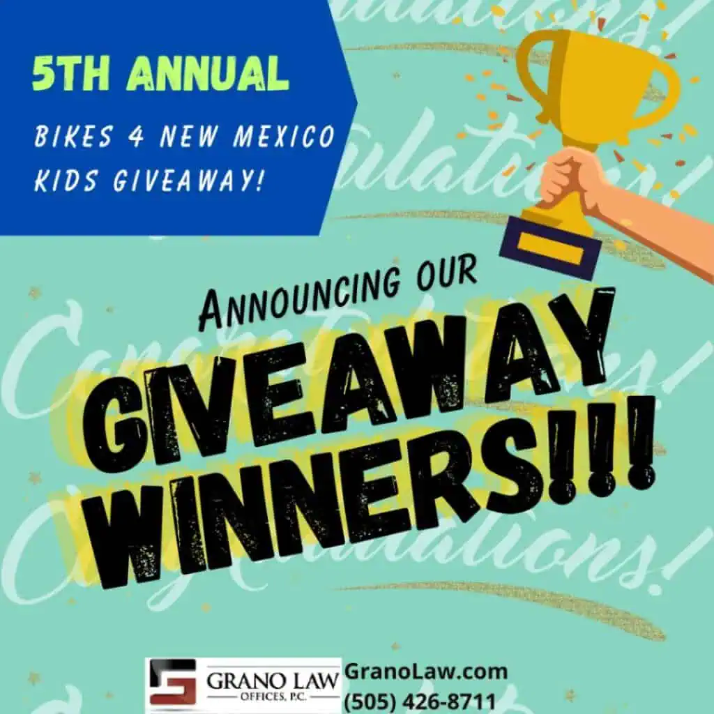 5th Annual "Bikes 4 NM Kids" Giveaway Winners Announced 1 A hand holds up a gold trophy against a teal background. The text reads, "5th Annual Bikes 4 New Mexico Kids Giveaway! Announcing Our Giveaway Winners!!"