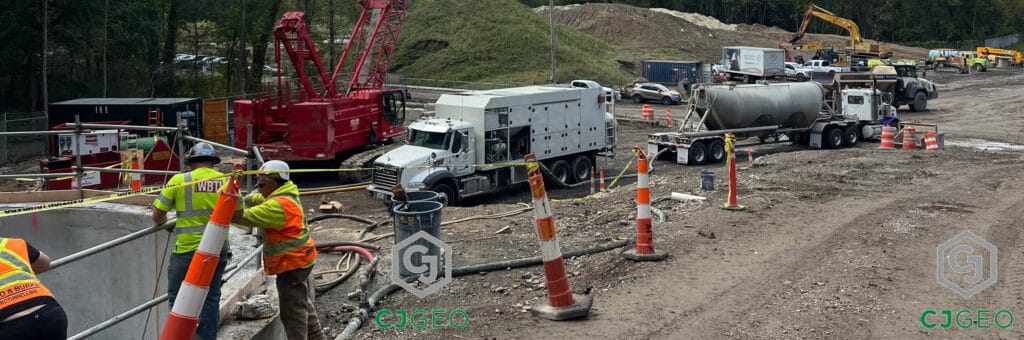 A CJGeo cellular grout plant and cement tanker next to a tunnel shaft, which is being grouted with cellular grout.