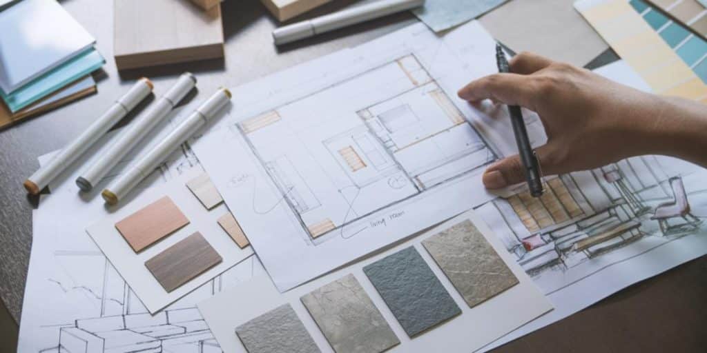 Interior designer sketching home layout for clean home design