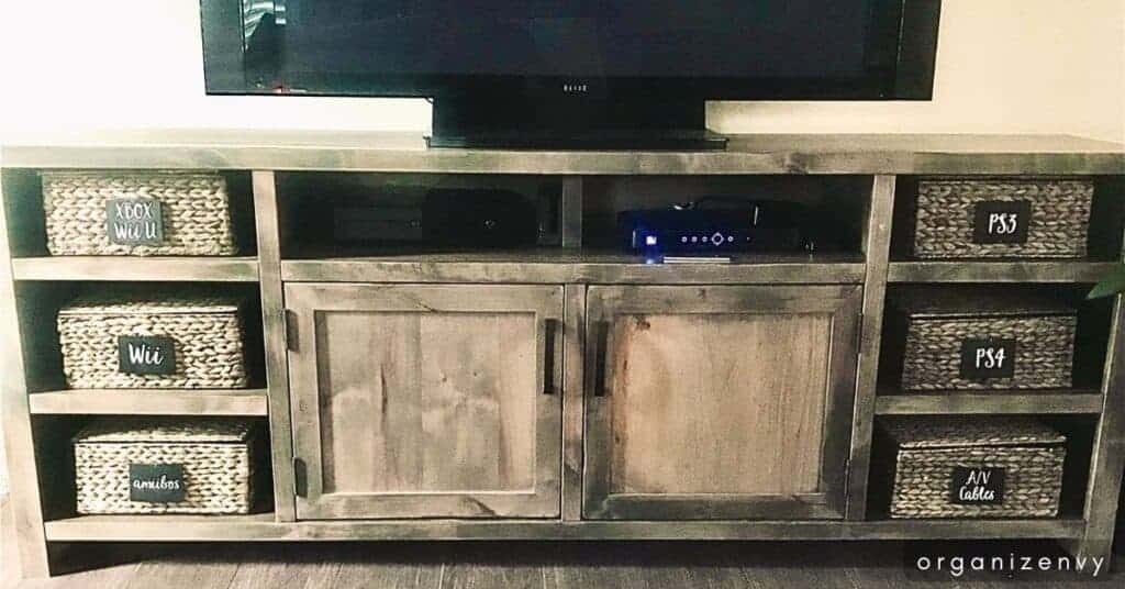 TV stand with baskets on shelves