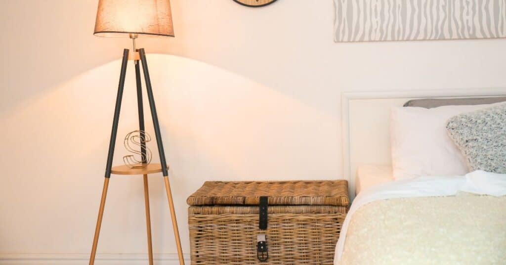 Bedroom with a wicker chest next to the bed