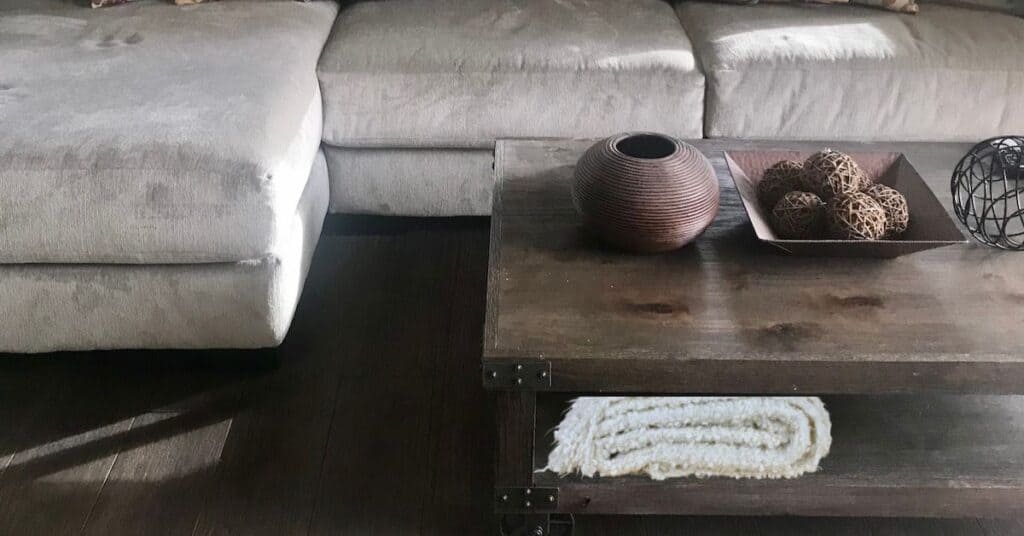 Family room with gray couch and wooden coffee table