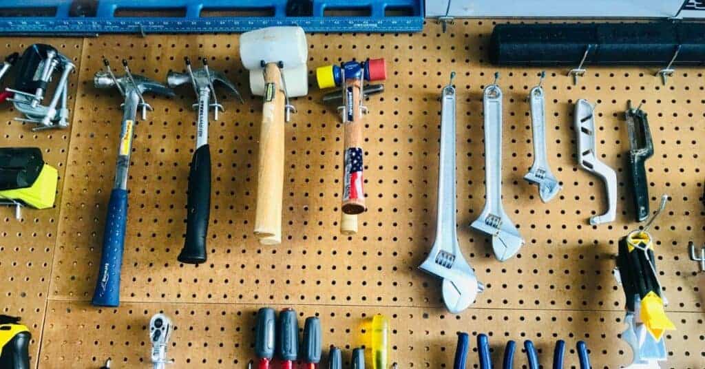 Tools hung on a pegboard in a garage