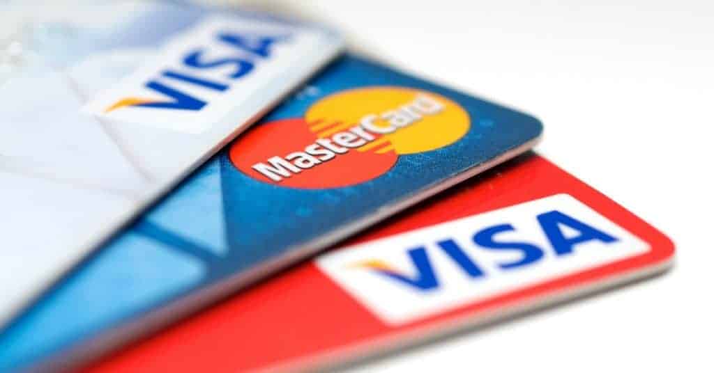 Image of three credit cards with which background - how to increase your credit and join the over 800 credit score club