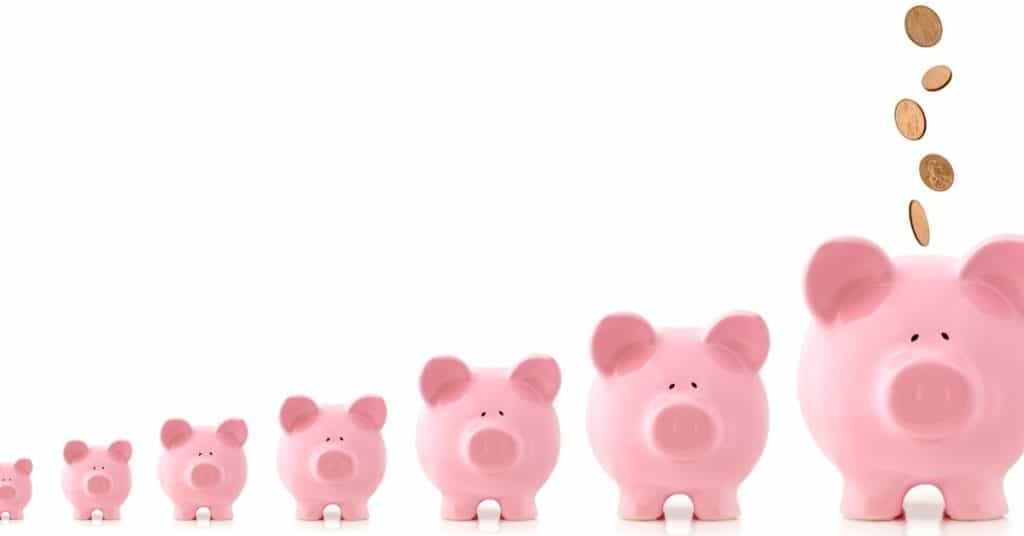 Line of piggy banks getting progressively bigger in size, representing retirement savings and compound interest.