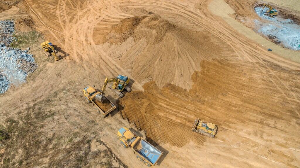 A drone's perspective of dirt trucks getting filled up on a construction site in TN. Tracking progress is one of the best examples of how drones help with construction.
