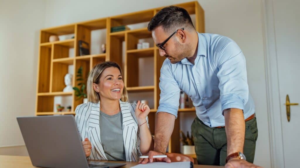 A Realtor and Client Happily Discussing