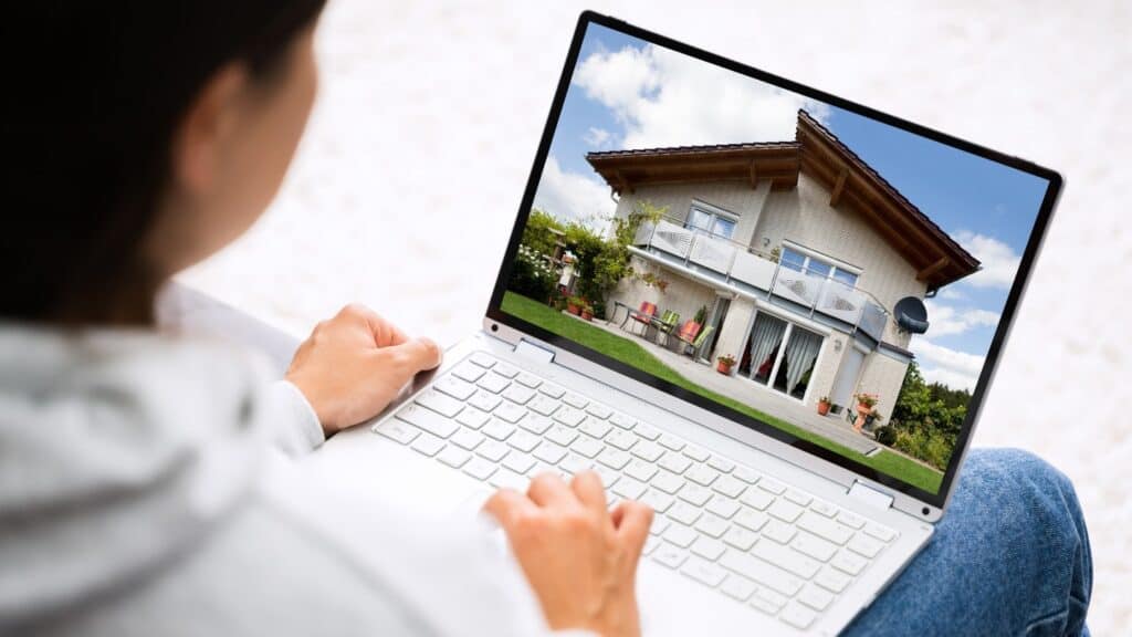 Person Looking at Homes using Computer