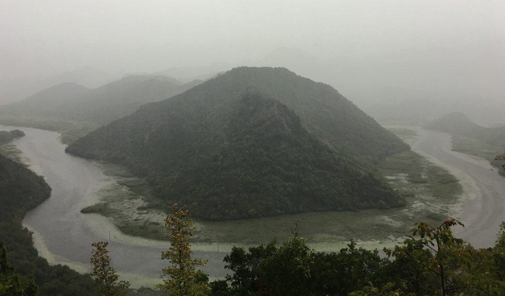 Lake Skadar: unfortunately this is the best picture I could take in the pouring rain. This iconic picture of one of Lake Skadar bend is spectacular and  usually lashing green , a part when is raining.