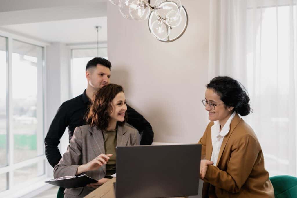 A Realtor Talking to Clients