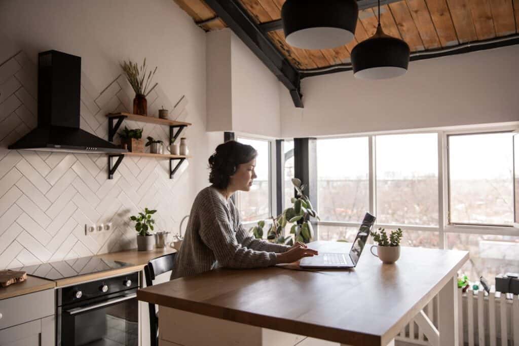 A Person Working from Home with her Laptop