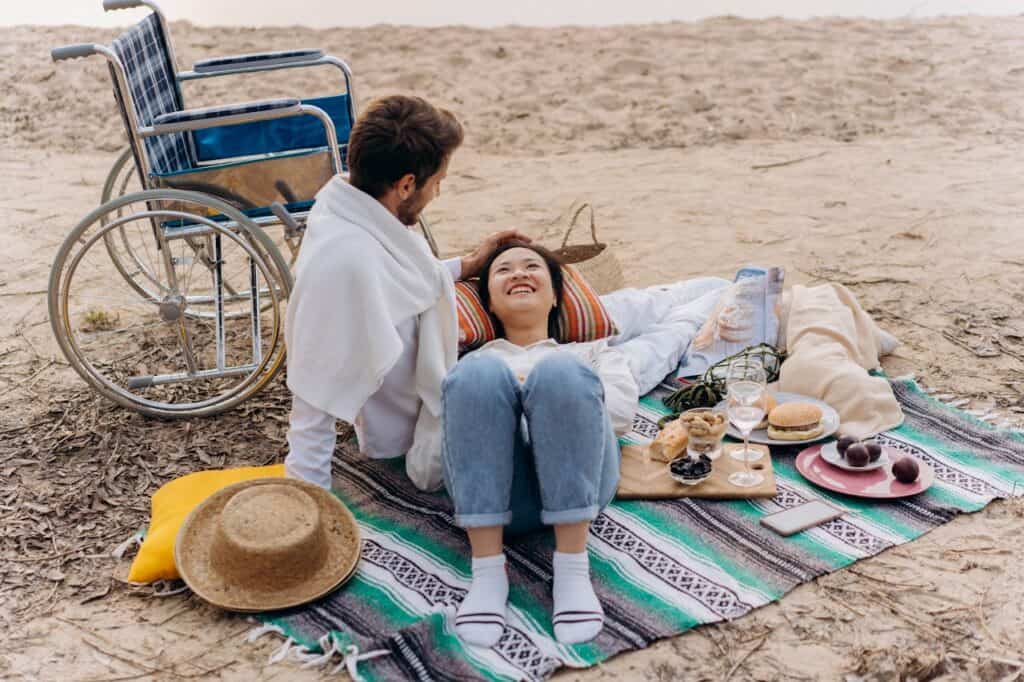 A Couple Enjoying a Picnic in the Beach