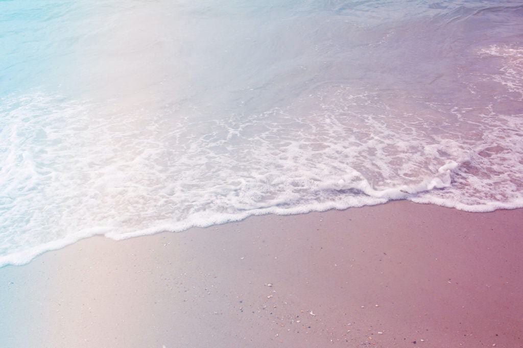 sandy beach with waves rolling up