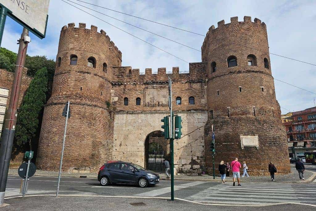 Ancient Roman gate Porta San Paolo next to the Piramide metro station in Rome, landmark starting point for trips to Ostia Antica.