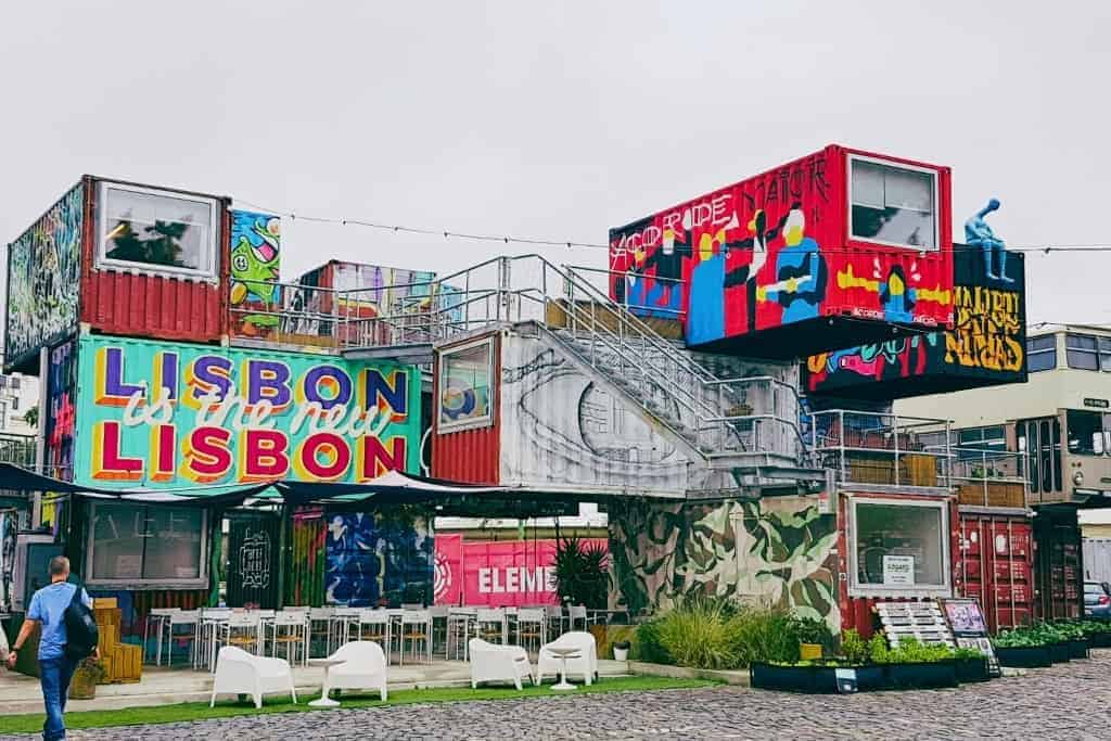 The colorful and artistic Village Underground in Lisbon, an alternative creative hub made from repurposed shipping containers and buses. A unique free spot in Lisbon for photography and urban exploration.