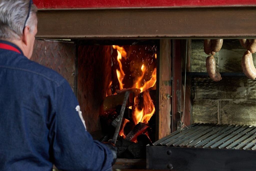 Family asado in Buenos Aires with Marcelo grilling traditional Argentine cuts on the parrilla.