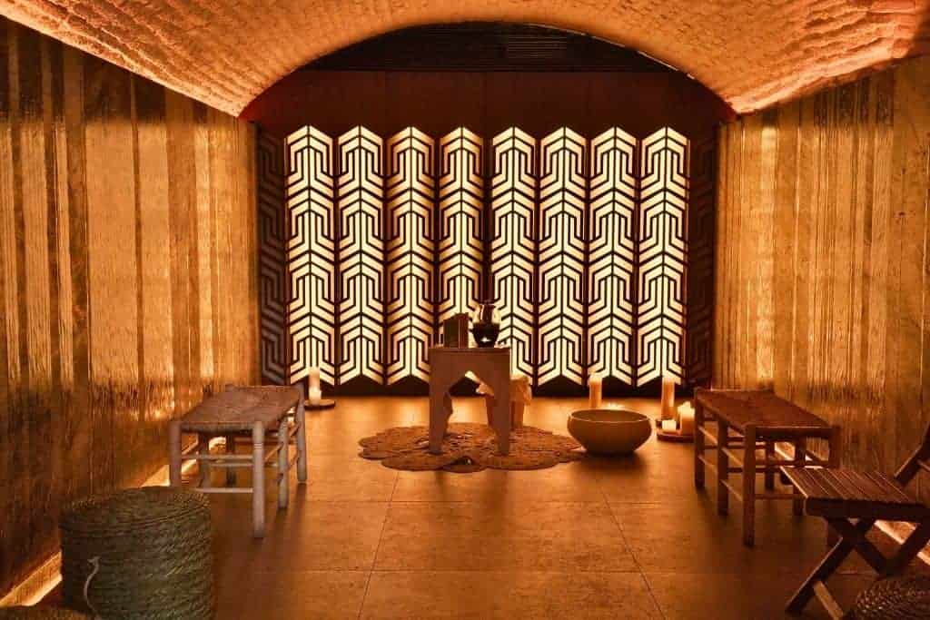 Candlelit room inside Hammam Al Ándalus in Granada – a serene modern Arab bath experience inspired by traditional Andalusian hammams, offering a relaxing hidden gem for wellness travelers.