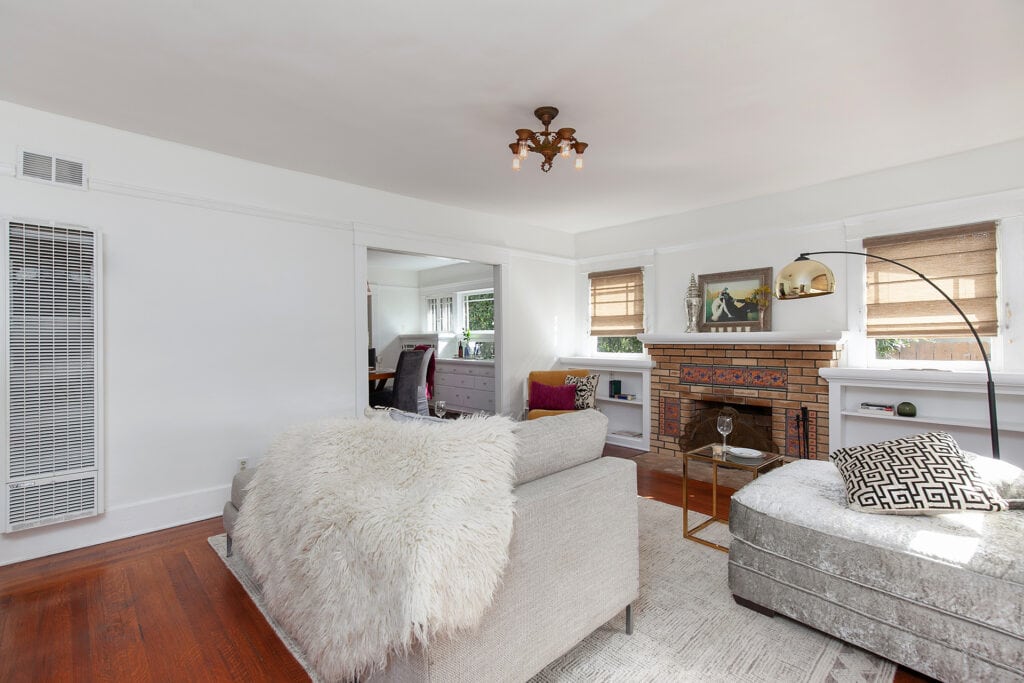 Living room at Ray Street in North Park San Diego with hardwood floors, bright natural light, and a comfortable open layout.