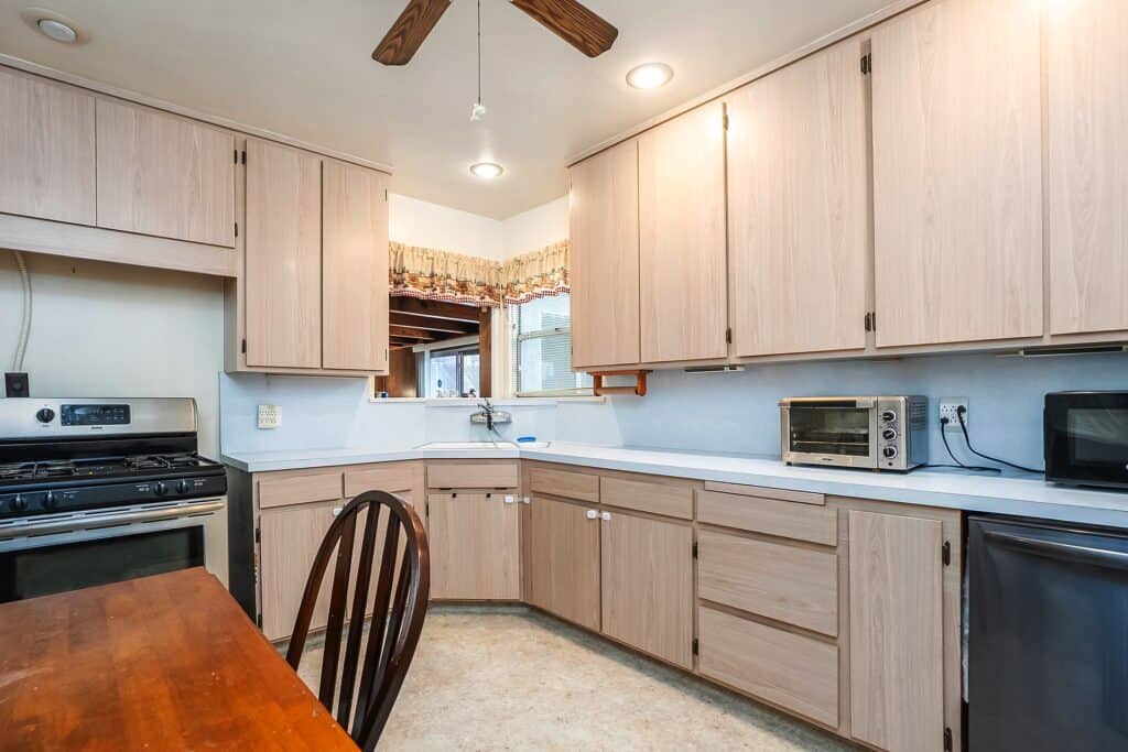 Bright mid-century kitchen at 1751 39th St with ample cabinetry and stainless steel appliances