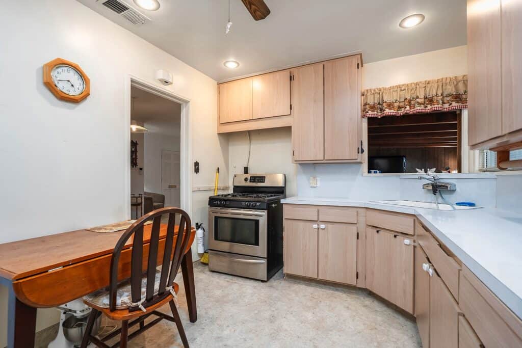 Bright mid-century kitchen at 1751 39th St with ample cabinetry and stainless steel appliances