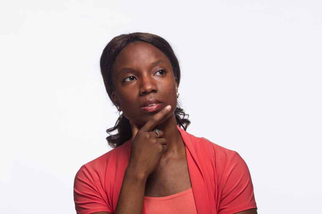 Woman contemplating what's stopping her from finding love in her 40s.