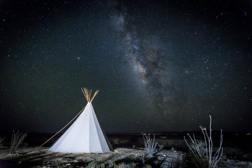 Tipis at night.