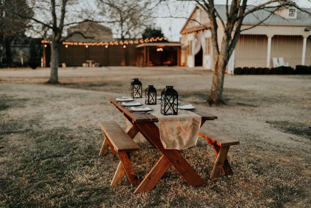 A lone table set out in a field.