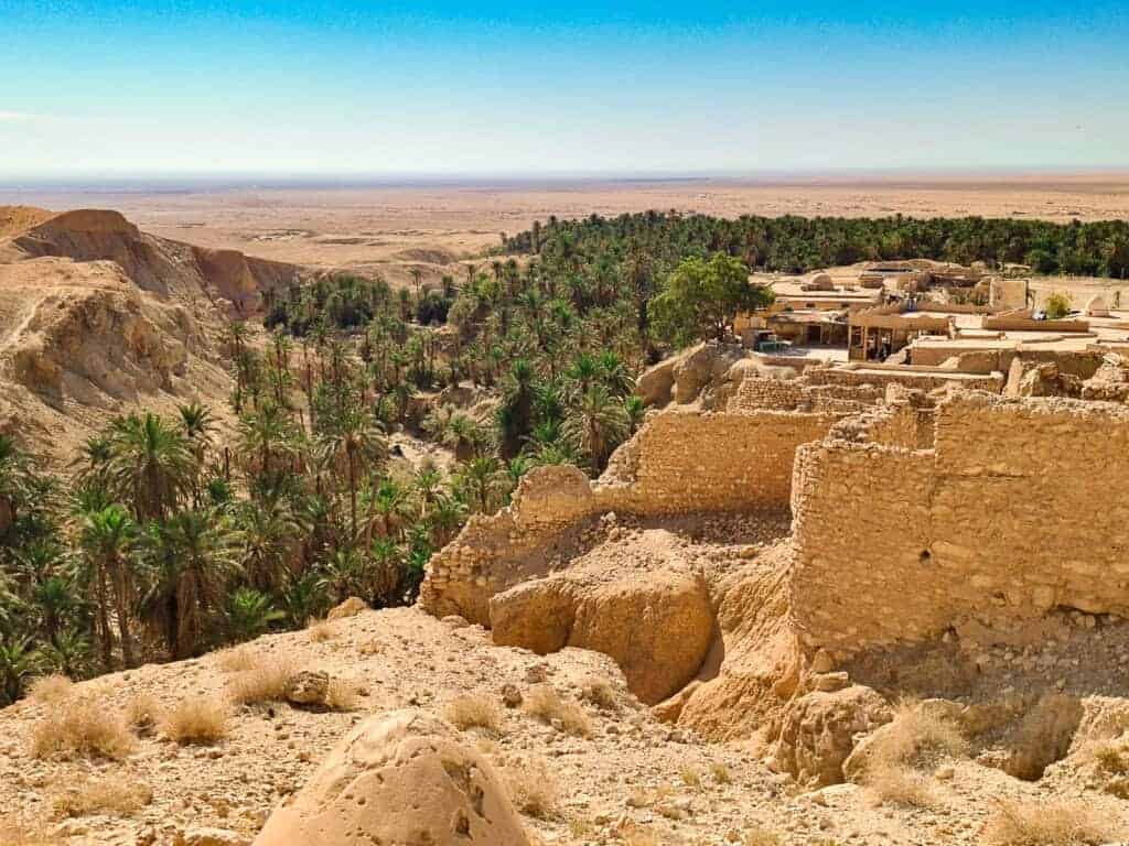 Panoramic view of As-Sabikah village with lush palm groves next to Chebika oasis in the Tunisian desert