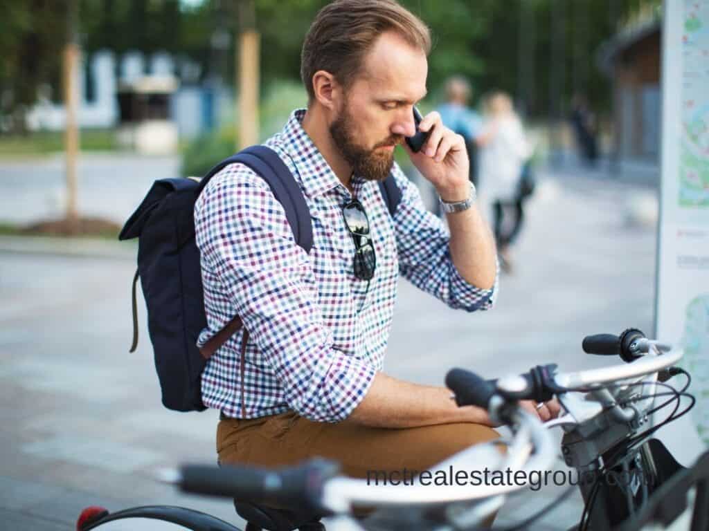 man on bike talking on the phone
