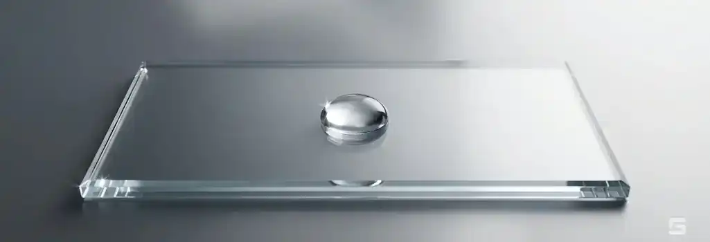 A clear glass floor tile with a single water drop on a slate gray background, representing premises liability and slip and fall hazards. Grano Law Offices, P.C.