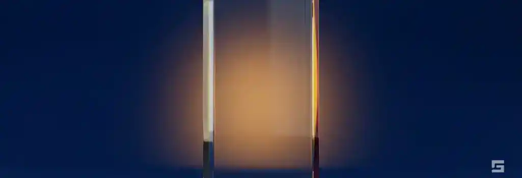A thick clear glass barrier illuminated by a safe amber glow on a navy blue background, representing constitutional rights and search warrants. Defense guidance from Grano Law Offices, P.C.