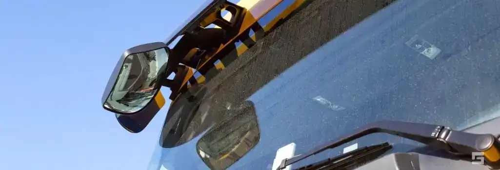 Mirror on a big rig that demonstrates whey proving a trucker caused blindspot accident injuries in NM is a challenge.