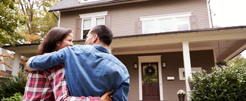 a family that is happy because learned how to buy a home