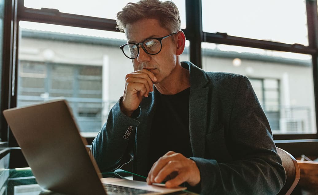 Blog Feature Image Man using laptop