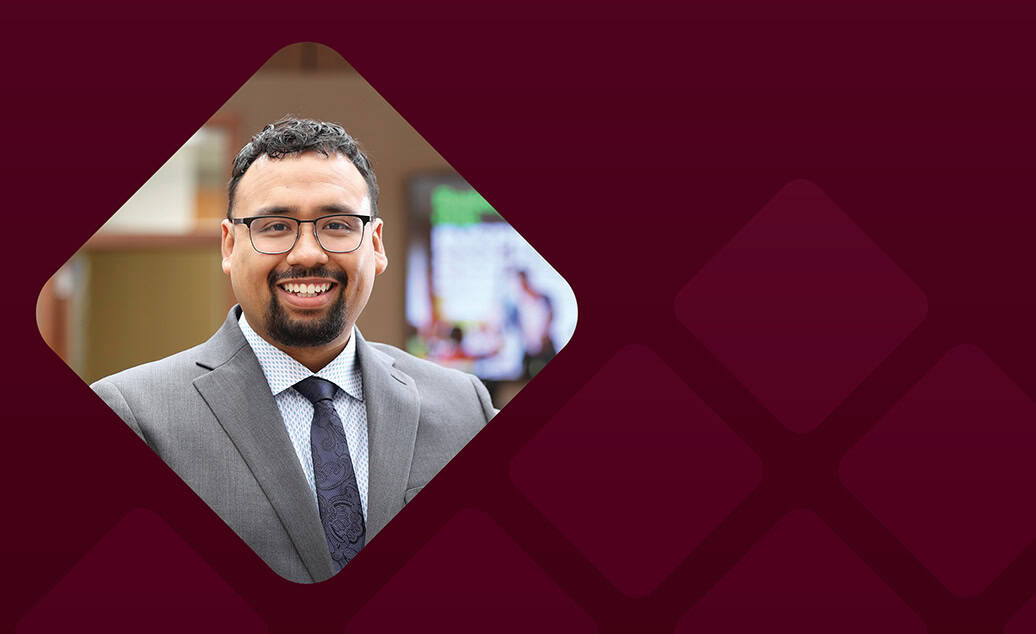 Allan Hernandex headshot with burgundy background