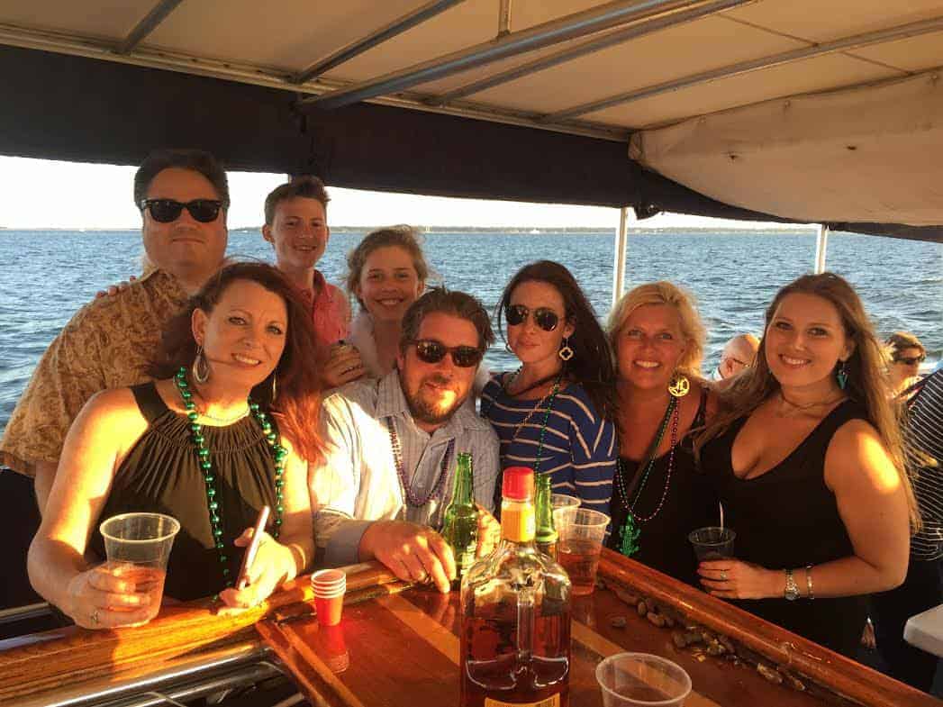 Group of people enjoying drinks at the bar. Private charter boat Charleston SC