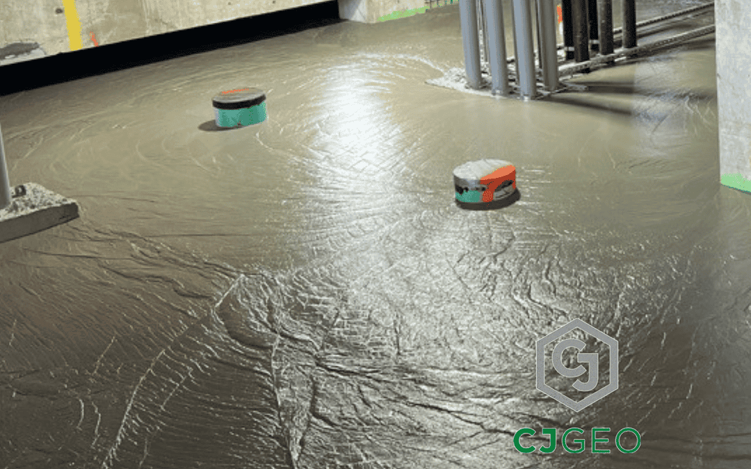CJFill-Standard cellular concrete poured around pipes and columns in a basement.