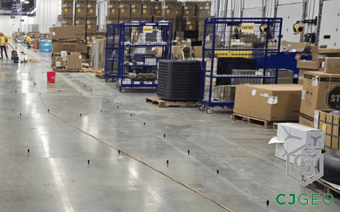 a large warehouse with people working on the floor