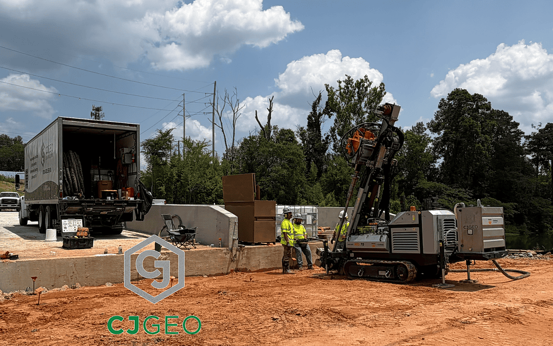 A sonic drill and polyurethane grouting equipment sitting adjacent to a bridge over a canal.