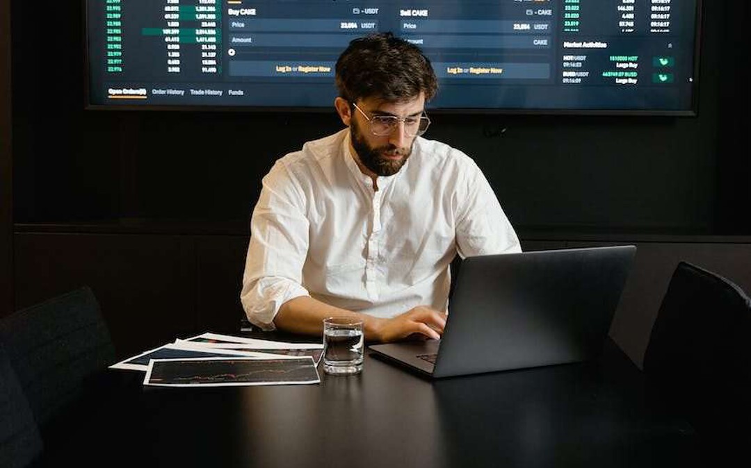 focused professional man using laptop